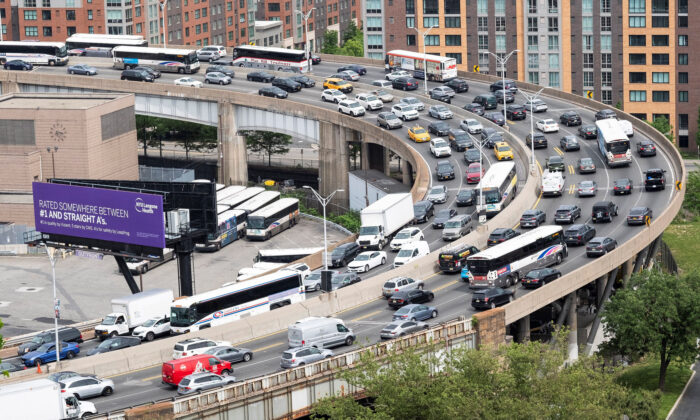 People drive outside the Lincoln Tunnel at the start of the Memorial Day weekend, under rising gas prices and record inflation, in Newport, N.J., on May 27, 2022. (Eduardo Munoz/Reuters)