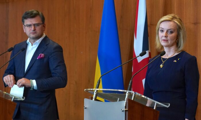 British Foreign Secretary Liz Truss (R) and Ukrainian Foreign Minister Dmytro Kuleba give a press statement at the British Embassy in Warsaw, Poland, on April 4, 2022. (Janek Skarzynski/AFP via Getty Images)
