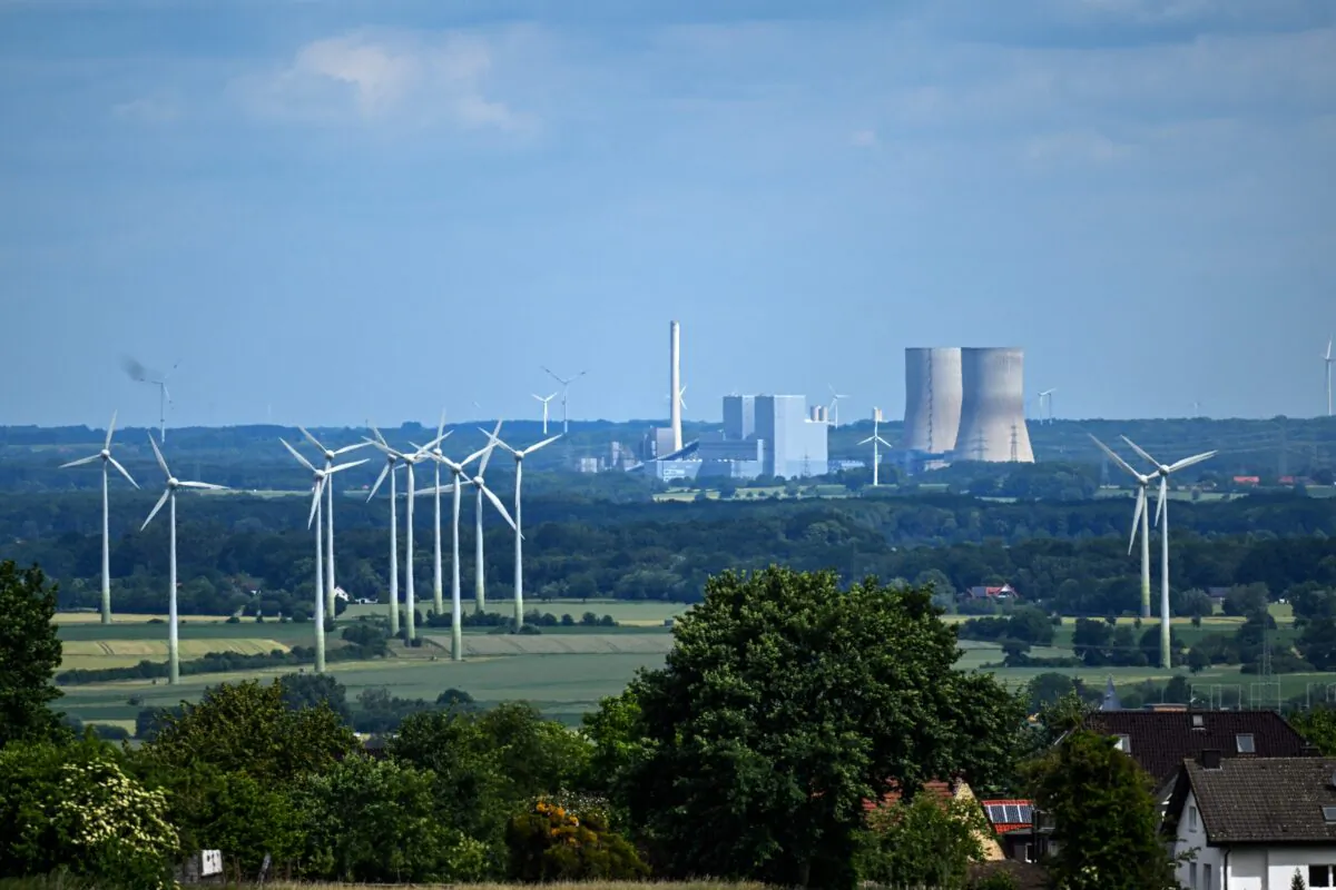 Wind turbines near a coal-fired power plant are pictured near Hamm, western Germany, on June 8, 2022. (INA FASSBENDER/AFP via Getty Images)