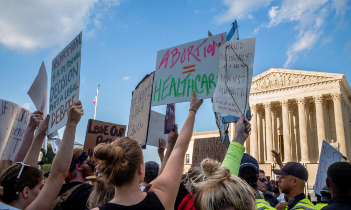 Abortion-rights demonstrators protest in front of the Supreme Court building in Washington following the announcement to the Dobbs v. Jackson Women's Health Organization ruling on June 25, 2022.  (Brandon Bell/Getty Images)