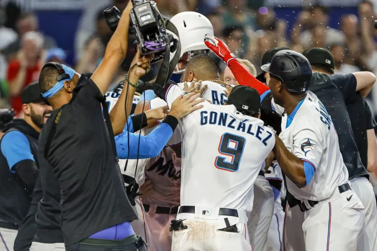 Miami Marlins celebrate at home plate after a walk-off home run by catcher Nick Fortes (54) in the ninth inning against the New York Mets at loanDepot Park in Miami on June 26, 2022. (Sam Navarro/USA TODAY Sports via Field Level Media)