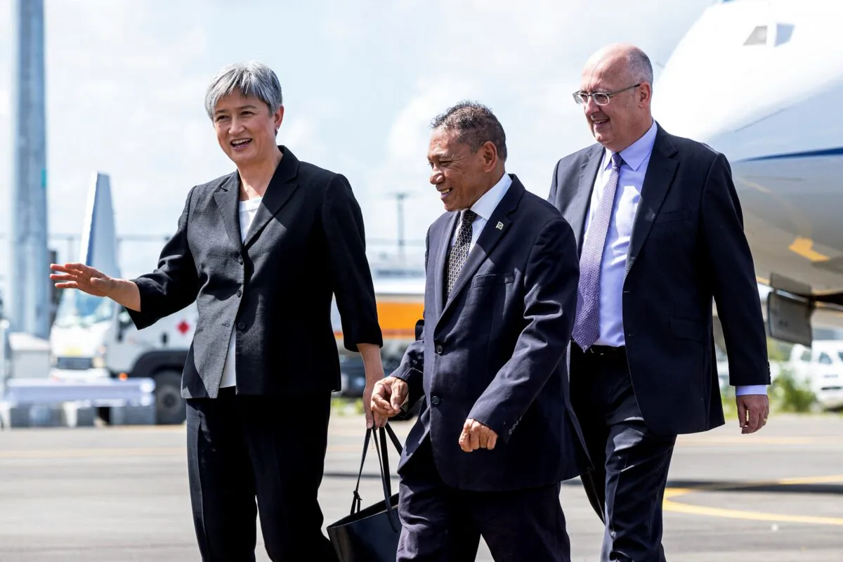 Australian Minister for Foreign Affairs Penny Wong (L) walking towards her car at the Henderson International Airport in Solomon Islands capital city Honiara on June 17, 2022. (JULIA WHITWELL/Australia's Department of Foreign Affairs/AFP via Getty Images)