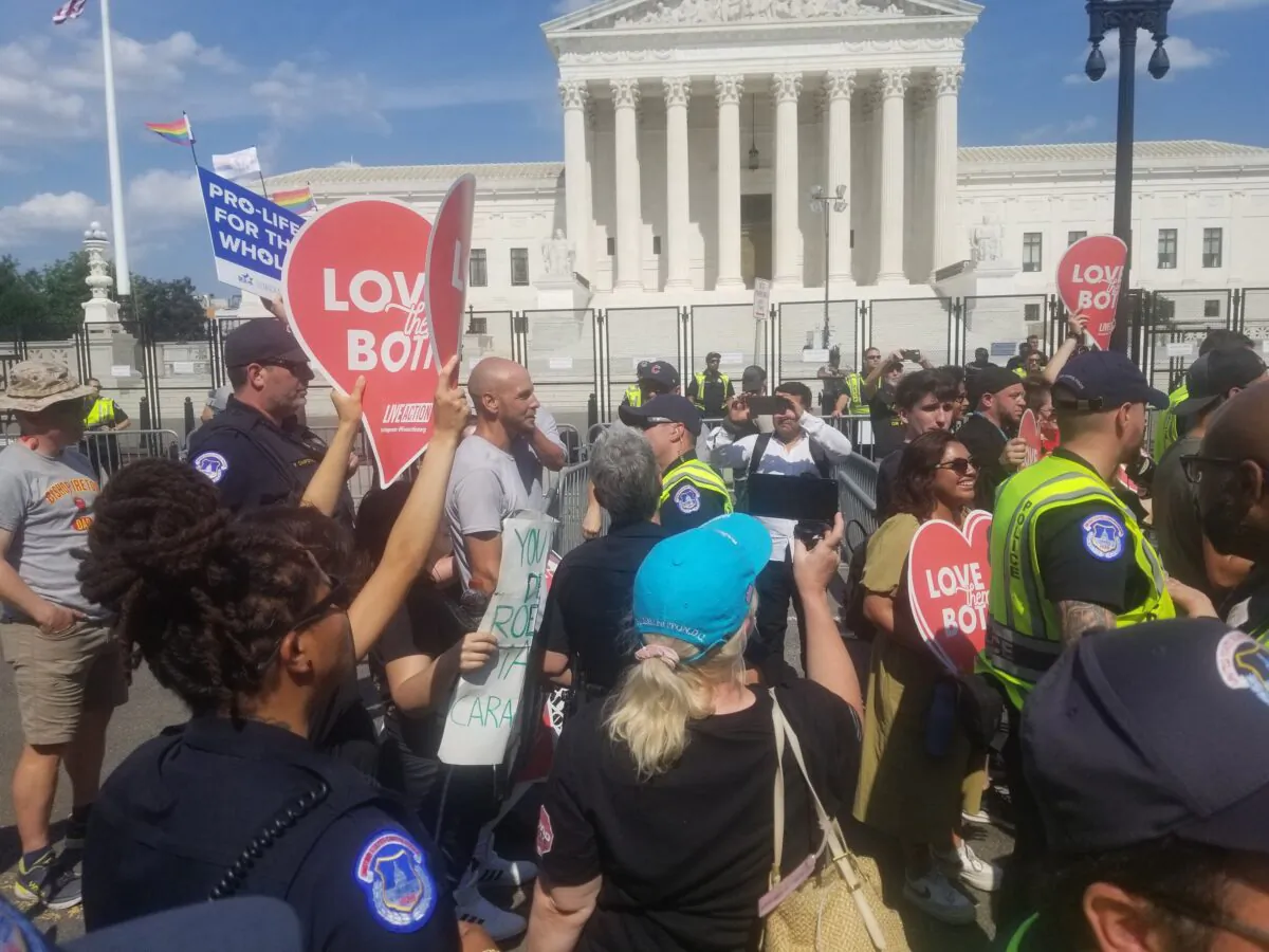 Confrontation between pro-life supporters and pro-abortion protesters in Washington on June 26, 2022. (Nathan Worcester/The Epoch Times)