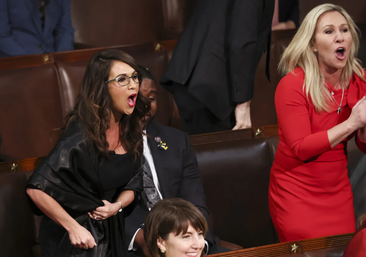U.S. Reps. Lauren Boebert (R-Colo.) and Marjorie Taylor Greene (R-Ga.) shout "Build the Wall" as U.S. President Joe Biden delivers the State of the Union address during a joint session of Congress in the U.S. Capitol’s House Chamber March 01, 2022 in Washington, DC. During his first State of the Union address Biden spoke on his administration’s efforts to lead a global response to the Russian invasion of Ukraine, efforts to curb inflation and bringing the country out of the COVID-19 pandemic. (Photo by Evelyn Hockstein-Pool/Getty Images)