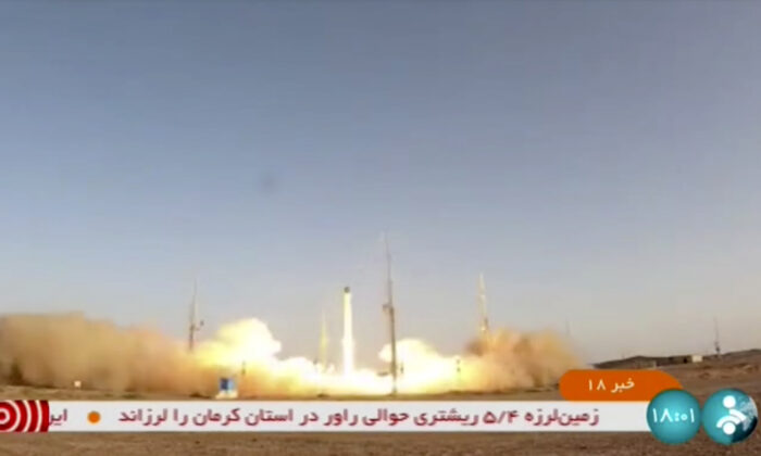 An Iranian satellite-carrier rocket, called “Zuljanah,” blasts off from an undisclosed location in Iran, in a frame grab from video footage released by Iran state TV (IRINN) on June 26, 2022. (IRINN via AP)