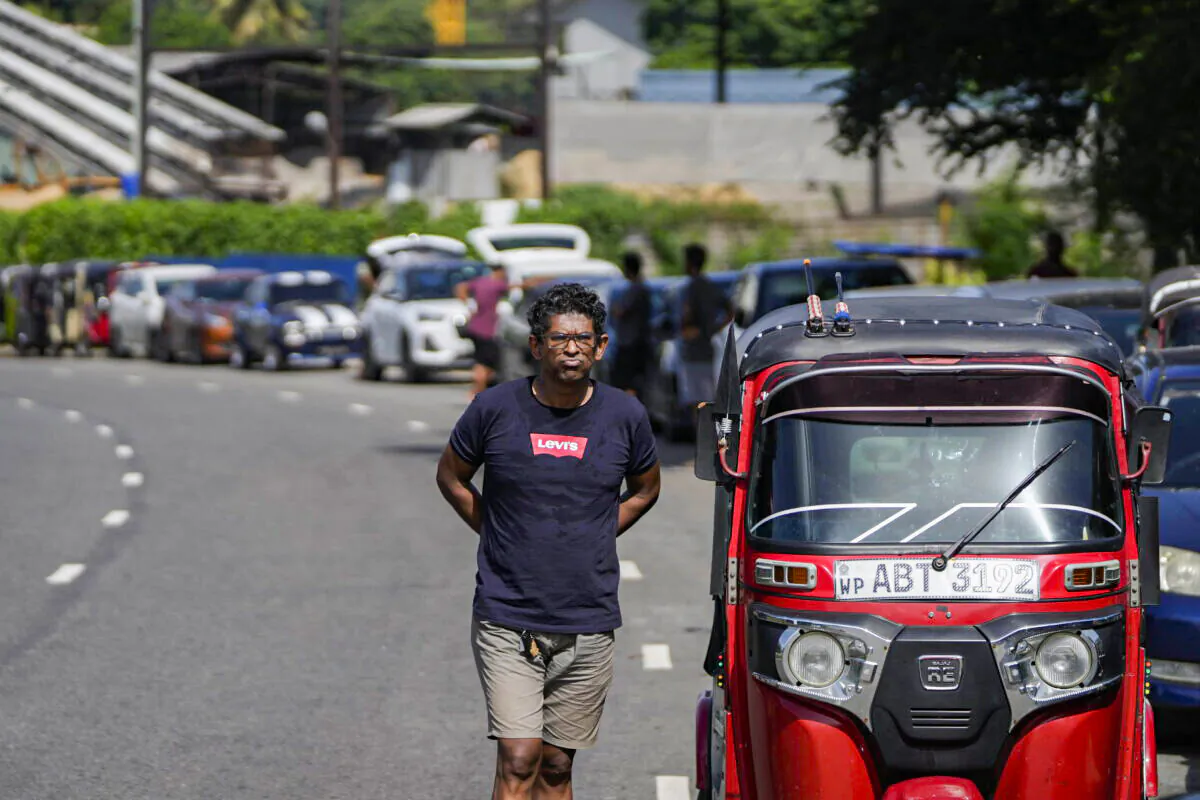 Motorists wait in line expecting to buy fuel in Colombo, Sri Lanka, on June 26, 2022. (AP Photo/Eranga Jayawardena)
