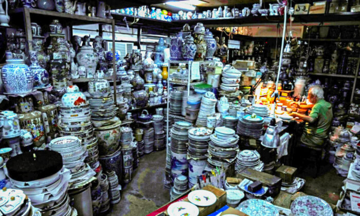 A staff member works at the Yuet Tung China Works, Hong Kong's porcelain factory, in Hong Kong, on June 8, 2022. (Kin Cheung/AP Photo)