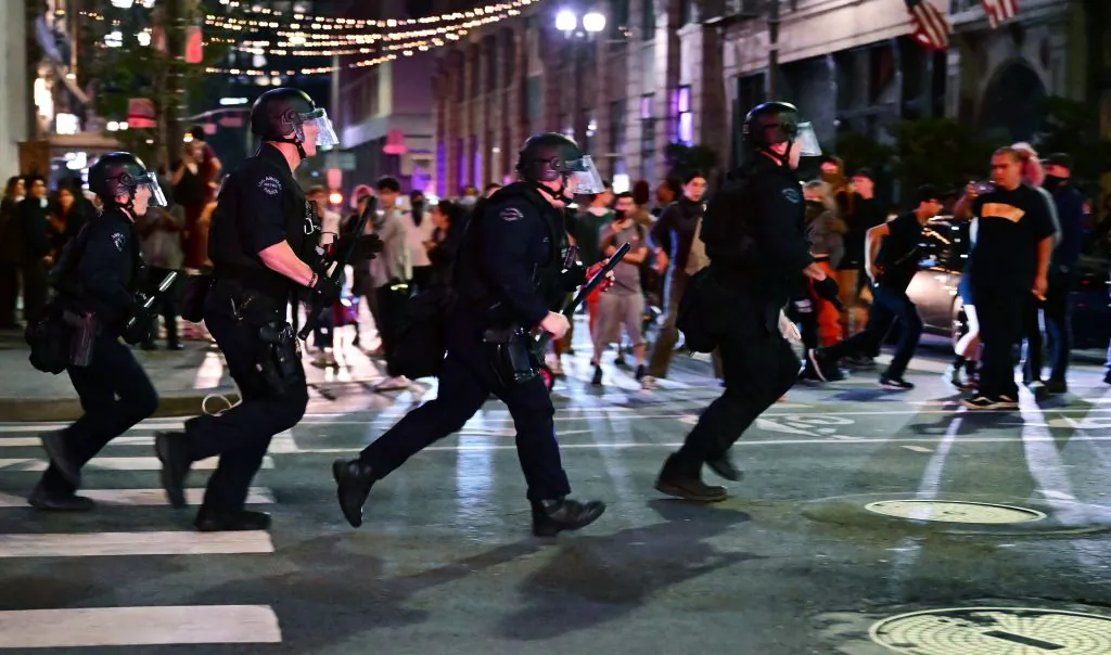 Police holding batons move to disperse a crowd of abortion rights activists protesting in Los Angeles after the overturning of Roe Vs. Wade by the US Supreme Court on June 24, 2022. (Frederic J. Brown/AFP via Getty Images)