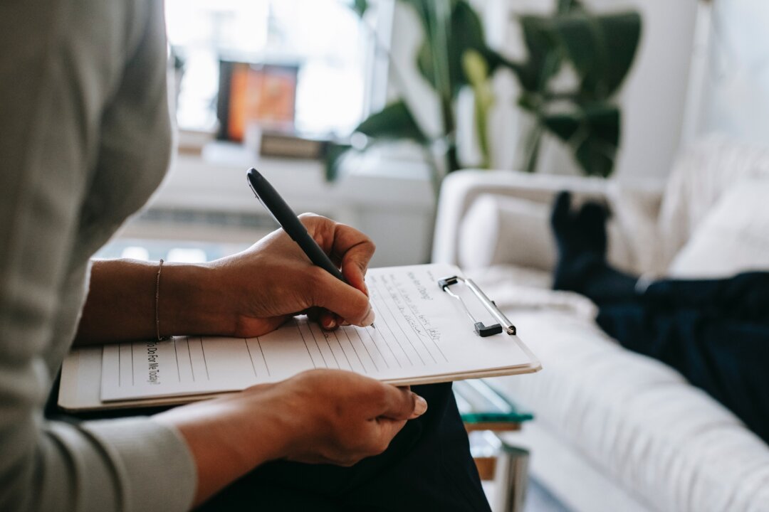 ‘Tell me about your mother."(Photo by Alex Green/Pexels): https://www.pexels.com/photo/crop-ethnic-psychologist-writing-on-clipboard-during-session-5699456/