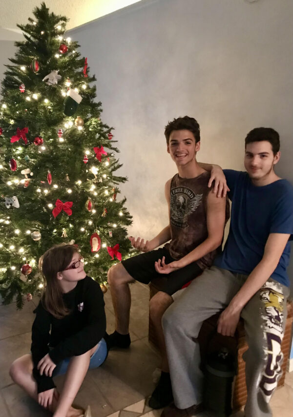 Angel and Kenneth Harrelson's children, Aimes, Nate and Trey on Christmas day, 2021.