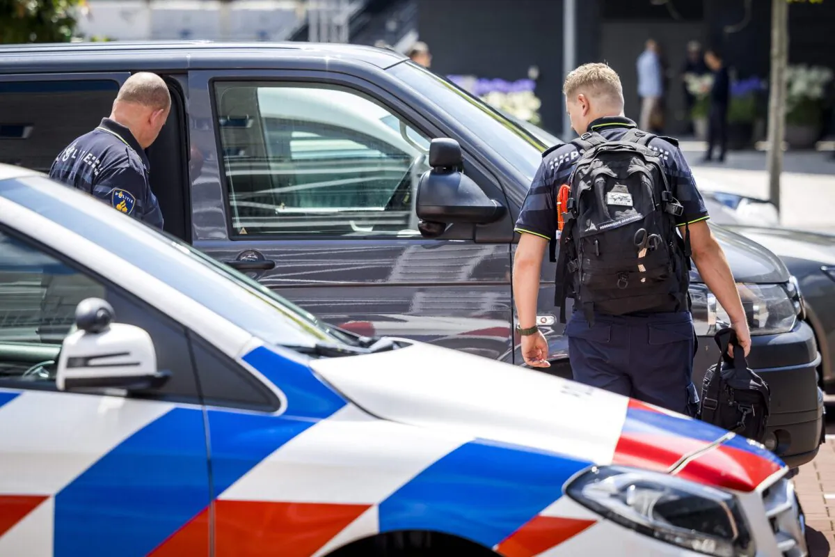 Dutch police officers stand guard near the entrance of the TEFAF Art Fair in Maastricht, Netherlands, on June 28, 2022. (Marcel Van Hoorn/ANP/AFP via Getty Images)