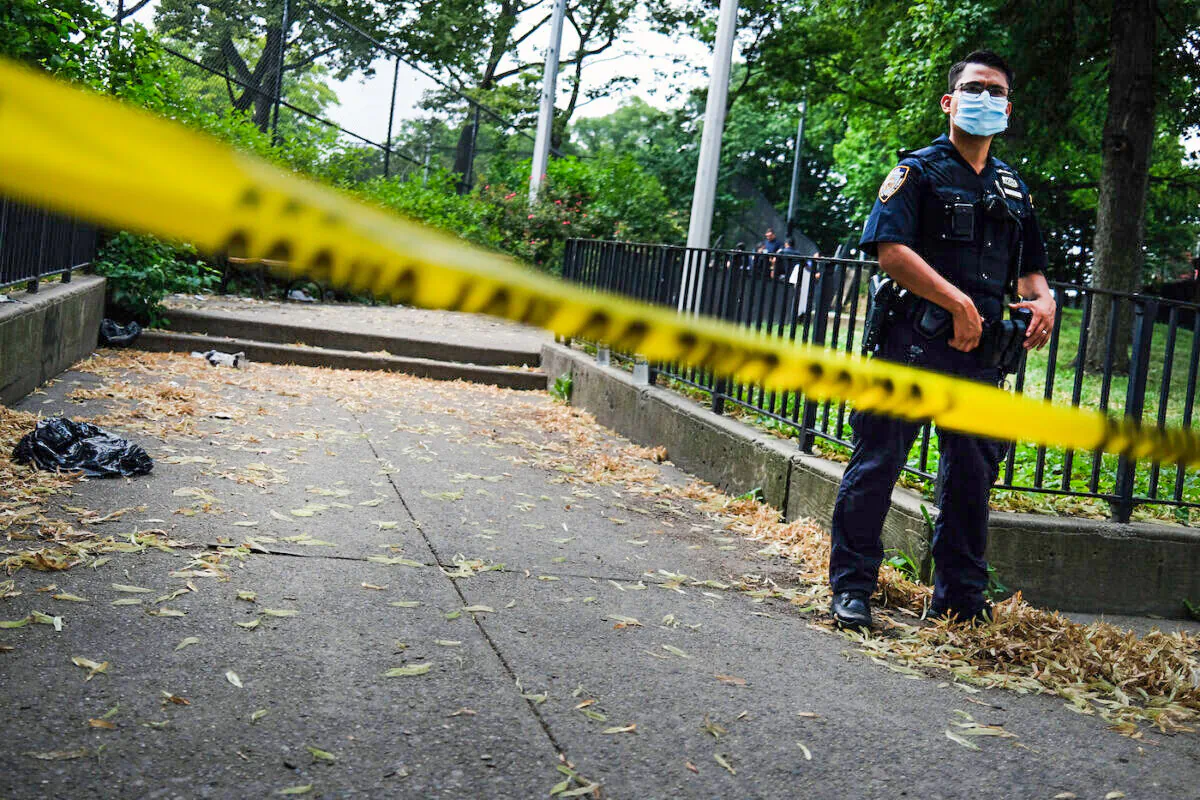 A police officer stands near the scene of an afternoon shooting that left one person dead in the Brooklyn borough of New York City on July 7, 2020. (Spencer Platt/Getty Images)