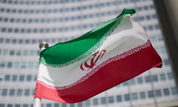 The flag of Iran in front of the building of the International Atomic Energy Agency (IAEA) Headquarters in Vienna on May 24, 2021. (Michael Gruber/Getty Images)