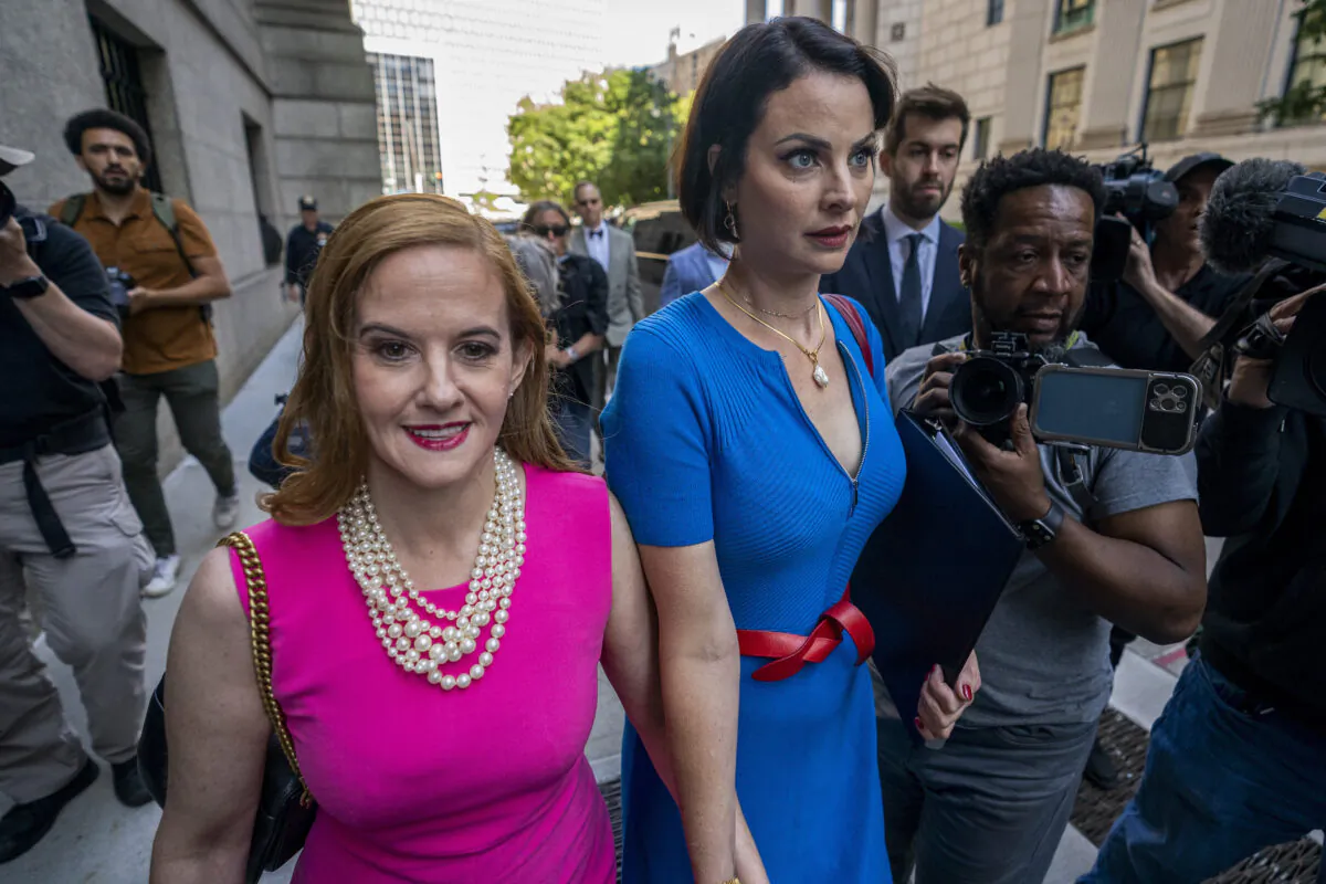 Sarah Ransome (R) and Elizabeth Stein, both victims of Jeffrey Epstein and Ghislaine Maxwell, walk to federal court on June 28, 2022, in New York. Maxwell, the jet-setting socialite who once consorted with royals, presidents and billionaires, was sentenced to 20 years in jail for helping wealthy financier Epstein sexually abuse underage girls. (AP Photo/John Minchillo)