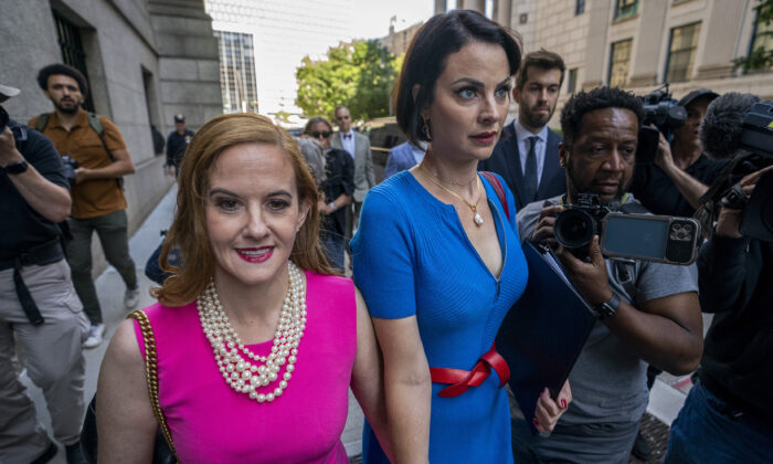 Sarah Ransome (R) and Elizabeth Stein, both victims of Jeffrey Epstein and Ghislaine Maxwell, walk to federal court on June 28, 2022, in New York. Maxwell, the jet-setting socialite who once consorted with royals, presidents and billionaires, was sentenced to 20 years in jail for helping wealthy financier Epstein sexually abuse underage girls. (AP Photo/John Minchillo)