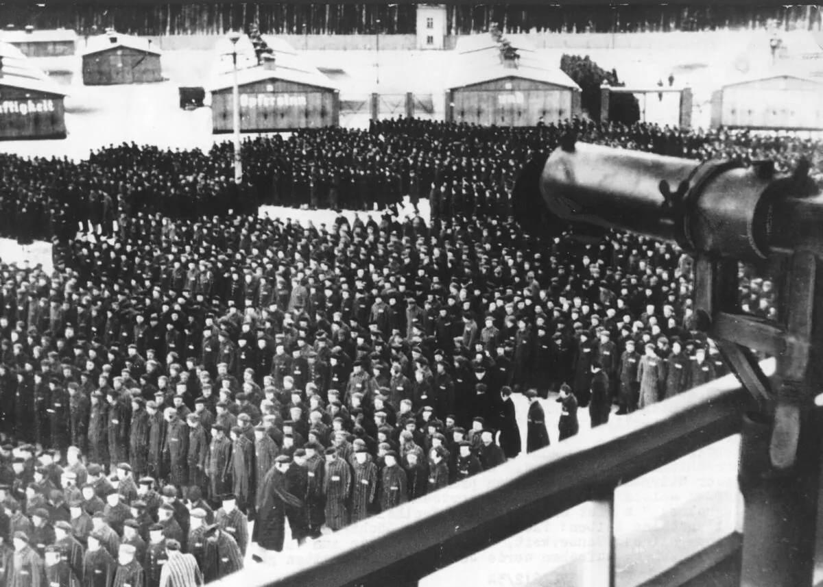 This undated photo shows a roll call, in the early morning or late evening hours, on the roll call square in front of the camp gate of the Nazi concentration camp Sachsenhausen in Oranienburg on the outskirts of Berlin. (AP Photo)