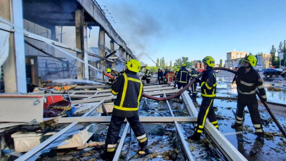 Rescuers work at a site of a shopping mall hit by a Russian missile strike in Kremenchuk, Poltava region, Ukraine, on June 27, 2022. (Press service of the State Emergency Service of Ukraine via Reuters)