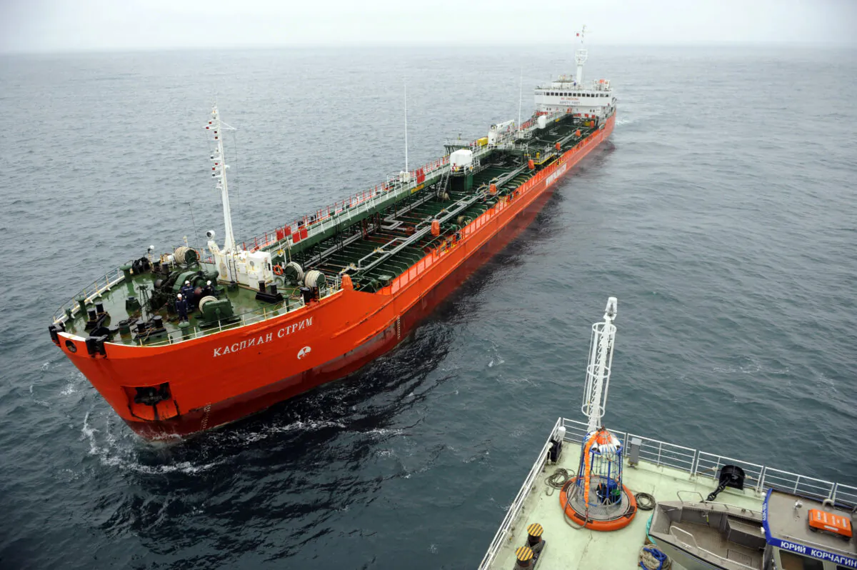 Russia's Caspian Stream tanker approaching the LUKOIL ice-resistant fixed platform LSP-1, at Korchagin's oil field outside Astrakhan on April 9, 2011. US and European energy sanctions on Russia have driven record discount prices for Russian oil. Currently, heavily discounted Russian crude oil and products are flowing to China and India. (Mikhail Mordasov / AFP)