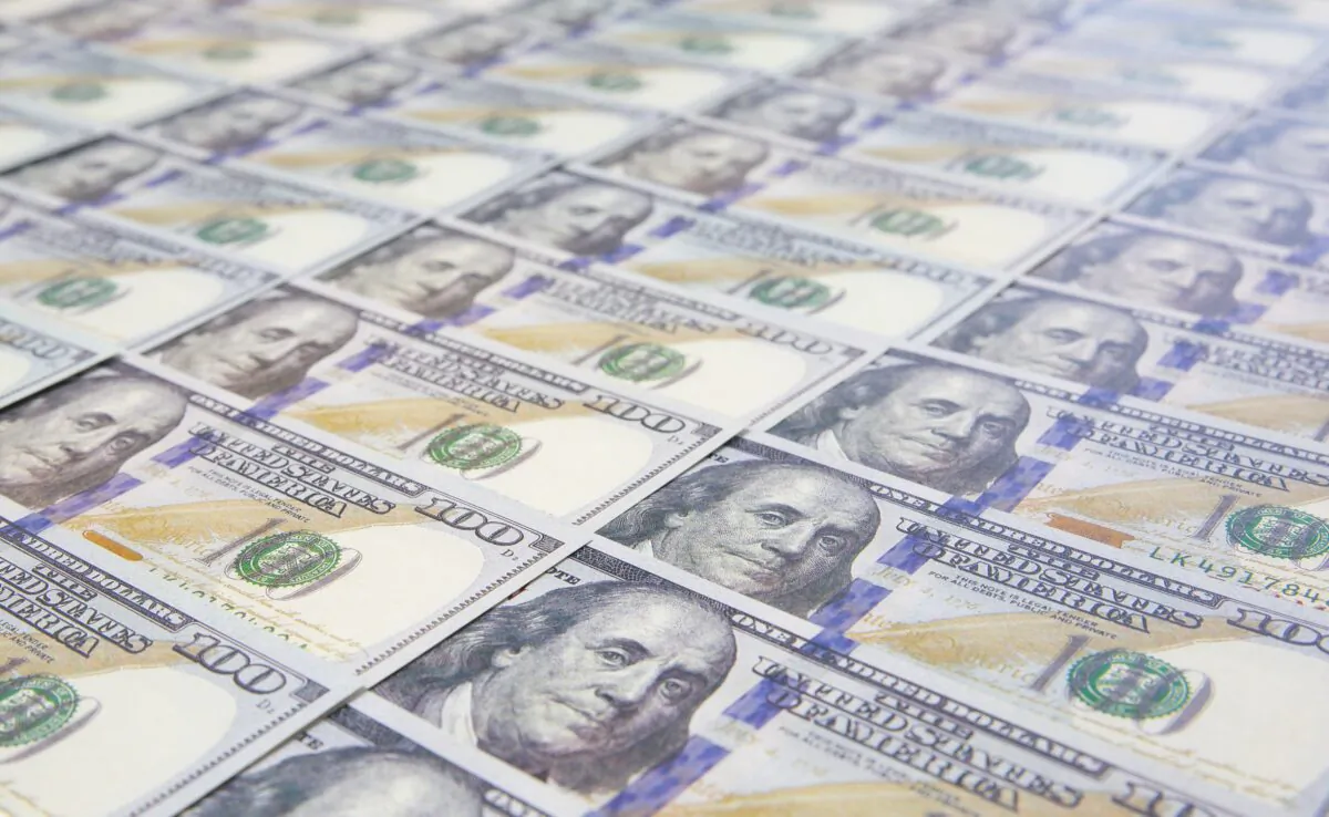 Newly printed $100 bills are shown in this file photo. (Only_NewPhoto/Shutterstock)