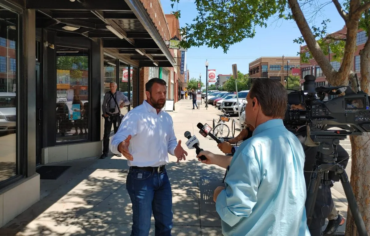 Oklahoma Republican US Senate candidate and US Rep. Markwayne Mullin talks to reporters and voters at a primary day campaign event on June 28 in Oklahoma City. (Jeff Louderback/Epoch Times) 