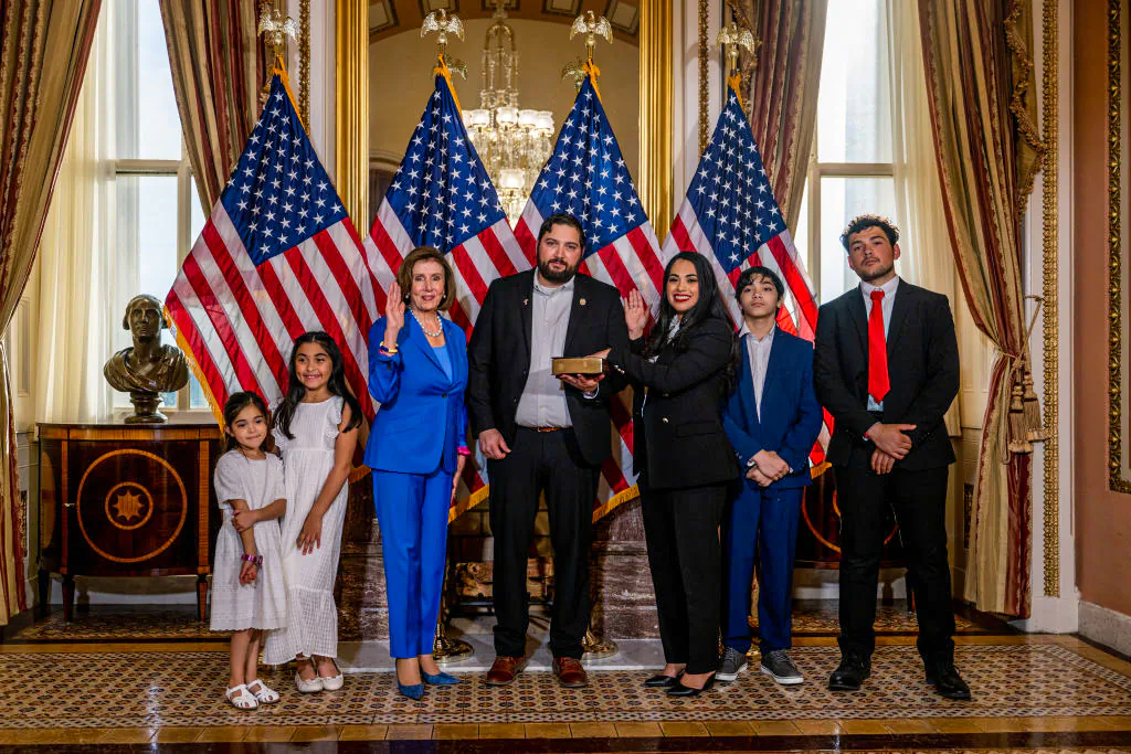 Rep.-elect Mayra Flores (R-Texas) stands with her family and Speaker of the House Nancy Pelosi (D-Calif.) for a portrait after being sworn-in in Washington, D.C., on June 21, 2022. (Brandon Bell/Getty Images)