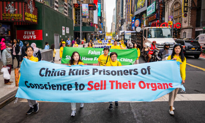 Falun Gong practitioners take part in a parade marking the 30th anniversary of the spiritual discipline's introduction to the public, in New York on May 13, 2022. (Samira Bouaou/The Epoch Times)