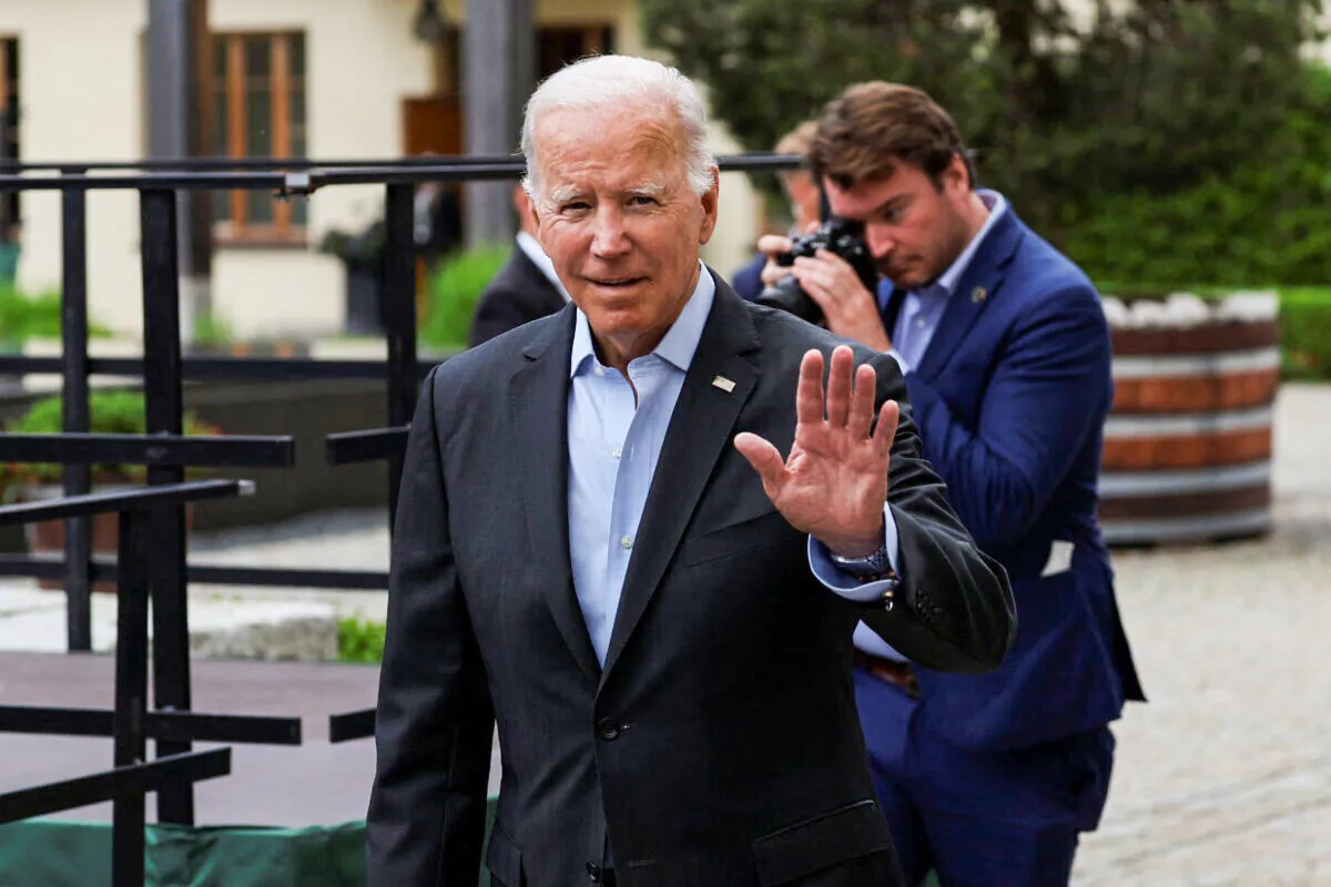 President Joe Biden waves, as G7 leaders meet with outreach guests for the working session at the Bavarian resort of Schloss Elmau castle, near Garmisch-Partenkirchen, Germany, on June 27, 2022. (Lukas Barth/Reuters)
