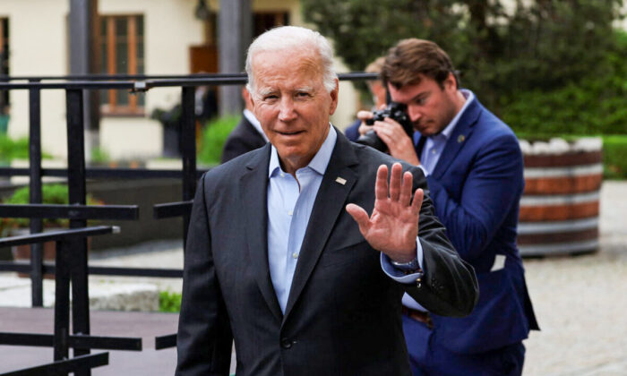 President Joe Biden waves, as G7 leaders meet with outreach guests for the working session at the Bavarian resort of Schloss Elmau castle, near Garmisch-Partenkirchen, Germany, on June 27, 2022. (Lukas Barth/Reuters)
