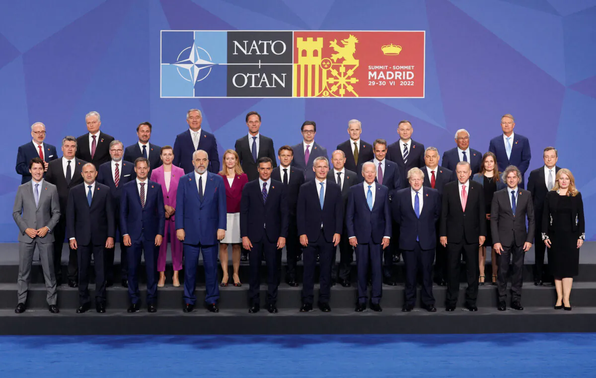 NATO heads of states and governments pose for a photo during a NATO summit in Madrid, on June 29, 2022. (Susana Vera/Reuters)