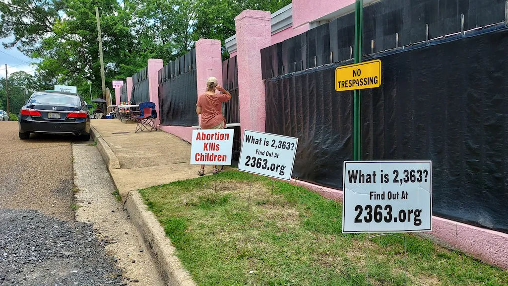 Anti-abortionist protesters have protested outside the Jackson Women's Health Organization, nicknamed the Pink House, in Mississippi for decades. (Matt McGregor/The Epoch Times)