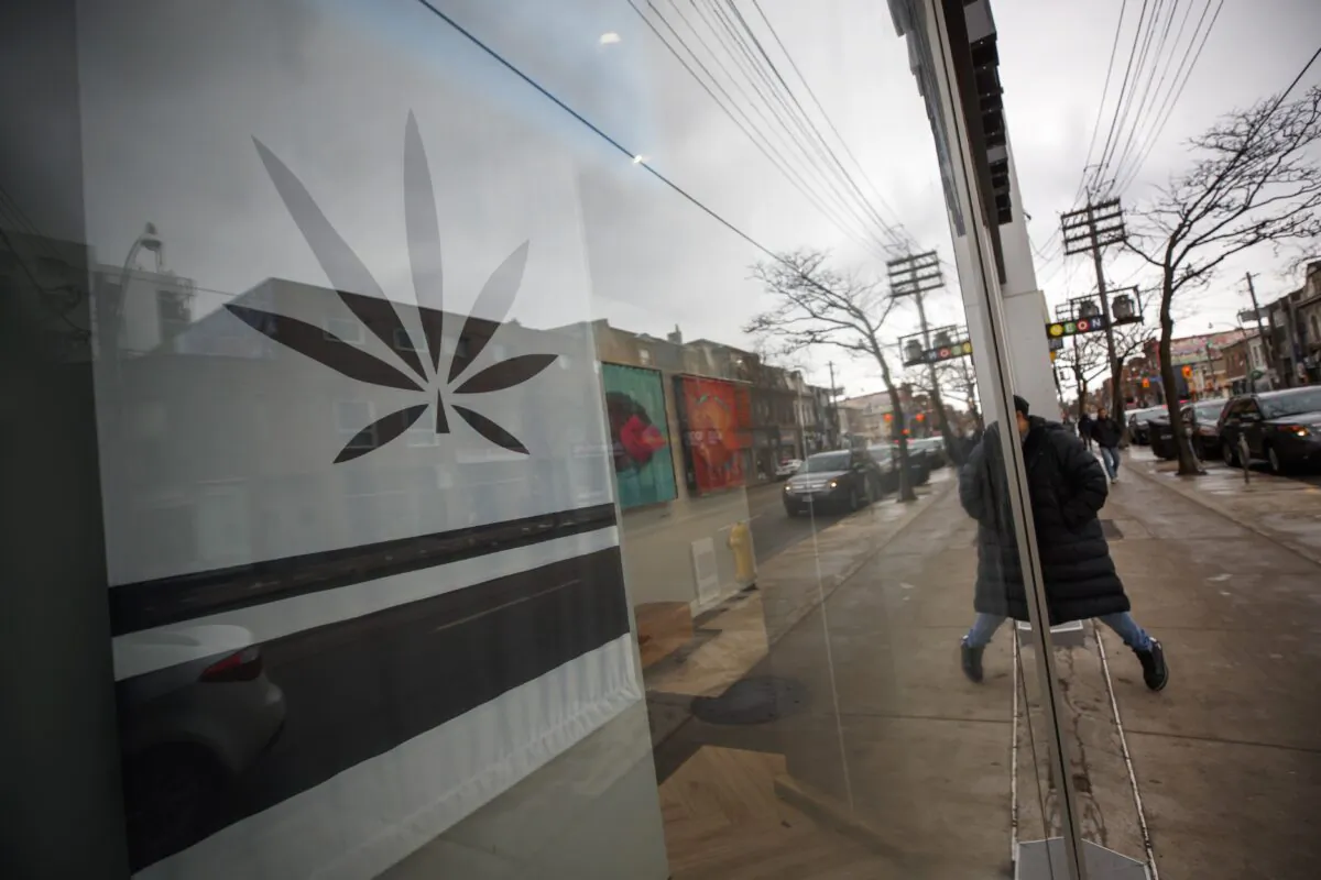 A customer enters a Cannabis dispensary on Queen St. in Toronto on Jan. 6, 2020. (Cole Burston/The Canadian Press)