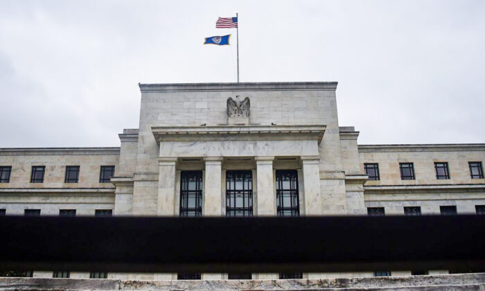 The Federal Reserve building is seen through a fence in Washington, D.C., on June 17, 2020. (Olivier Douliery/AFP via Getty Images)