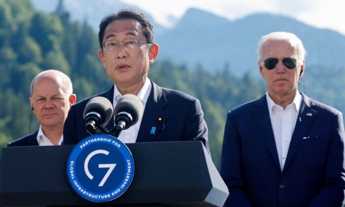 Japan's Prime Minister Fumio Kishida addresses a press conference next to German Chancellor Olaf Scholz and US President Joe Biden during the G-7 Summit at Elmau Castle, southern Germany, on June 26, 2022. (Jonathan Ernst/ AFP via Getty Images)