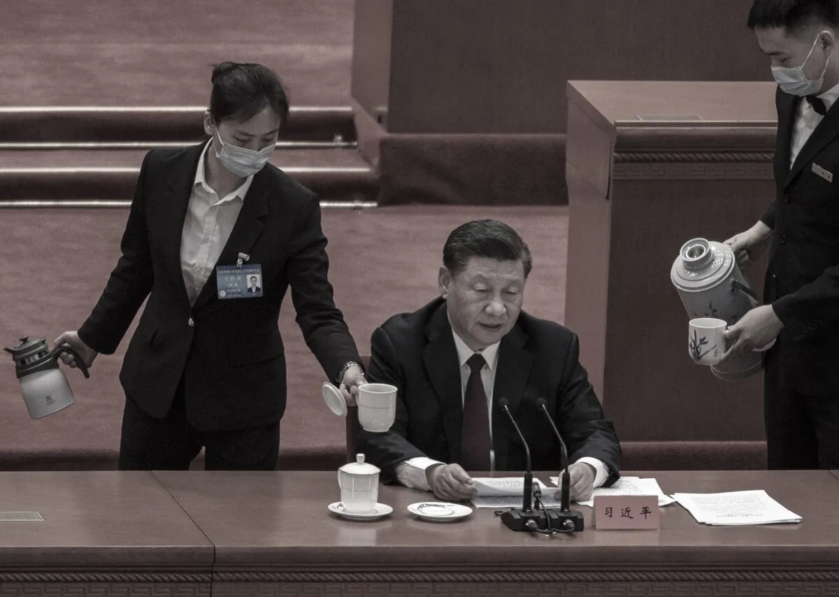 Chinese leader Xi Jinping, is served tea as he speaks during a ceremony at the Great Hall of the People in Beijing, China, on April 8, 2022. (Kevin Frayer/Getty Images)