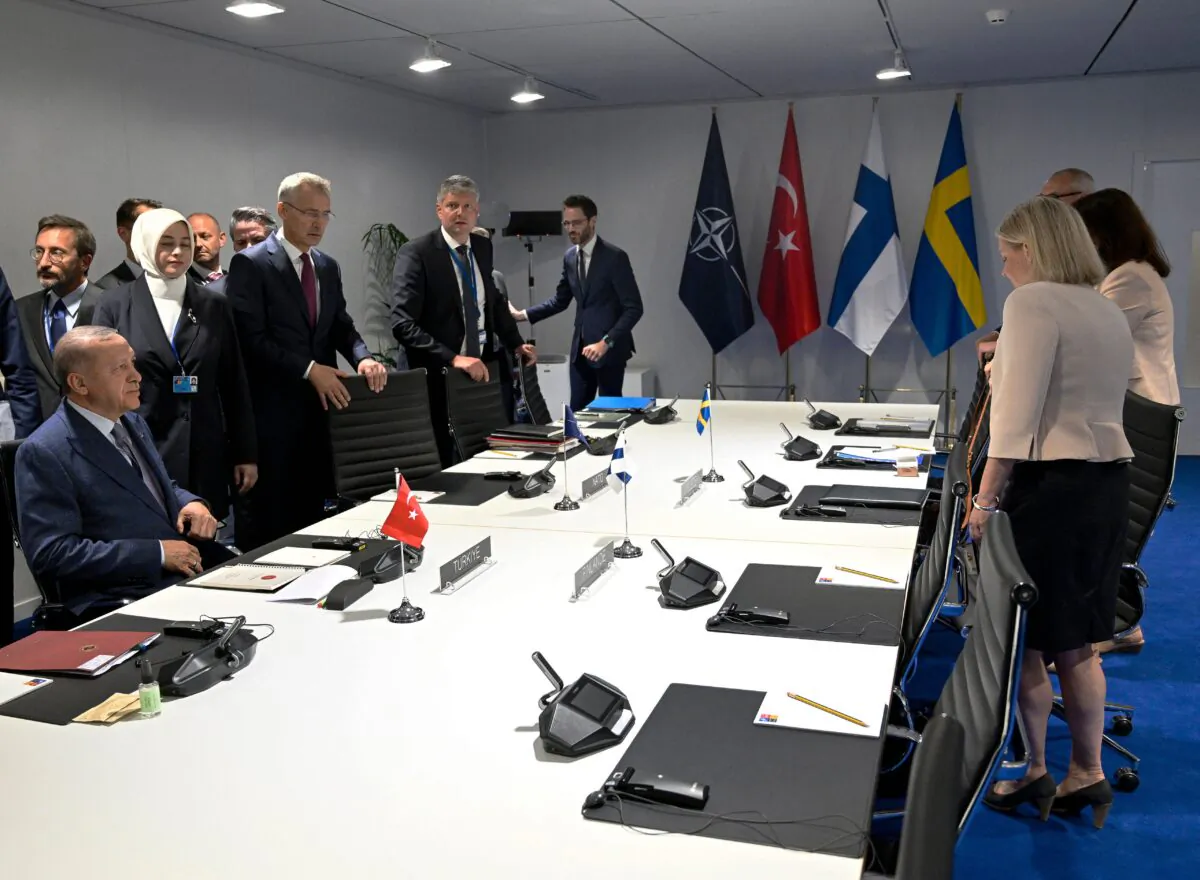 Turkey's President Recep Tayyip Erdogan (L), NATO Secretary General Jens Stoltenberg (C) and Sweden's Prime Minister Magdalena Andersson take part in a meeting on the sidelines of the NATO summit in Madrid, on June 28, 2022. Erdogan has refused to greenlight the applications from Sweden and Finland despite calls from his NATO allies to clear the path for them to enter. (Henrik Montgomery/TT News Agency/AFP via Getty Images)