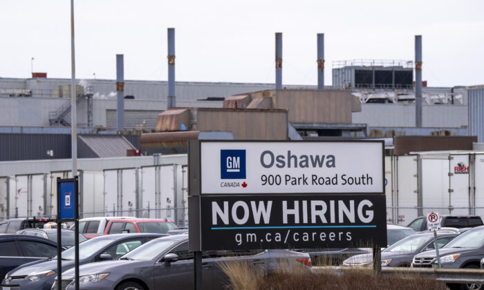A sign announcing hiring at the General Motors facility in Oshawa, Ont., on April 4, 2022. (The Canadian Press/Frank Gunn)