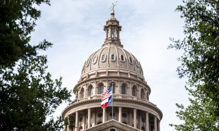 The United States and Texas state flags fly outside the state Capitol building on July 12, 2021 in Austin, Texas. (GettyImages)