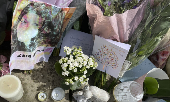 Floral tributes, candles and cards left at the scene on Cranbrook Road where Zara Aleena was murdered on in the early hours of Sunday June 26, 2022, in Ilford, England, on June 29, 2022. (Ted Hennessey/PA via AP)