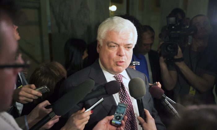 New Democratic Party MPP Peter Tabuns answers questions from the media in Toronto on Feb. 21, 2013. (The Canadian Press/Michelle Siu)