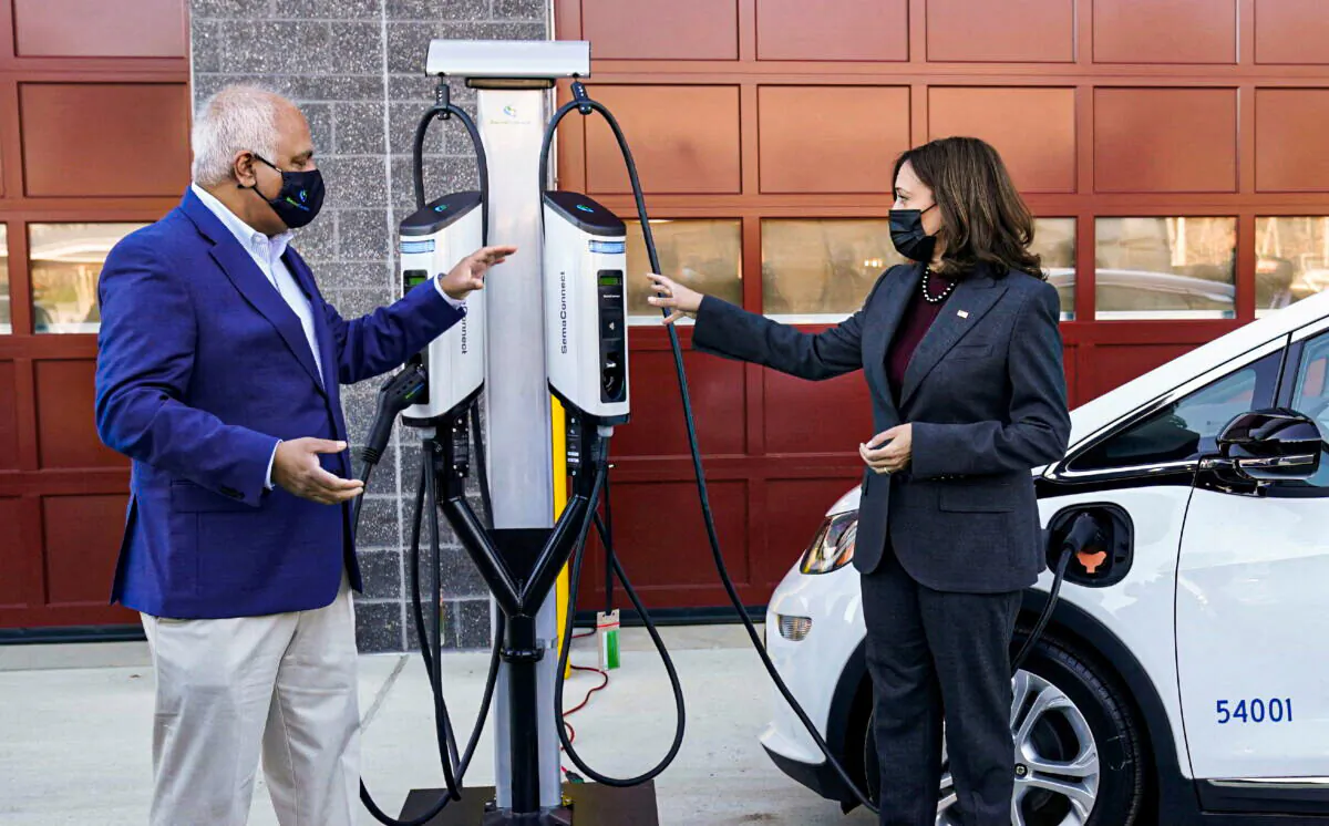 Vice President Kamala Harris speaks with SemaConnect CEO Mahi Reddy during a visit to announce the Biden administration’s Electric Vehicle Charging Action Plan, in Brandywine, Maryland, on Dec. 13, 2021. (Kevin Lamarque/Reuters)