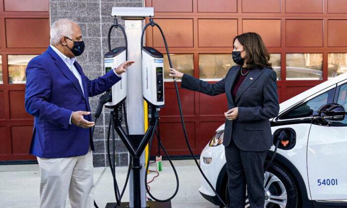 Vice President Kamala Harris speaks with SemaConnect CEO Mahi Reddy during a visit to announce the Biden administration’s Electric Vehicle Charging Action Plan, in Brandywine, Maryland, on Dec. 13, 2021. (Kevin Lamarque/Reuters)