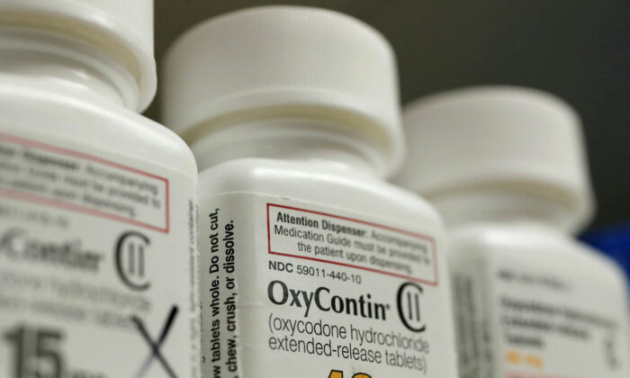 Bottles of prescription painkiller OxyContin made by Purdue Pharma LP sit on a shelf at a local pharmacy in Provo, Utah, on April 25, 2017.  (George Frey/Reuters)