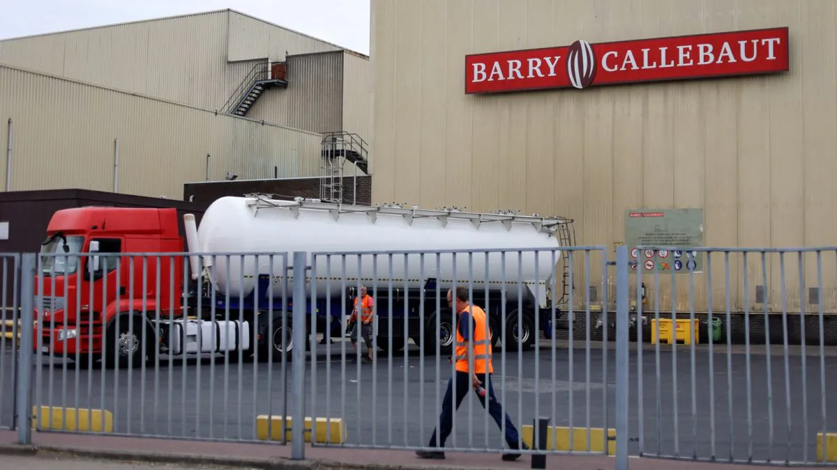 Employees walk at Barry Callebaut production site in Wieze, near Brussels, on June 30, 2022. (Kenzo Tribouillard/AFP via Getty Images)