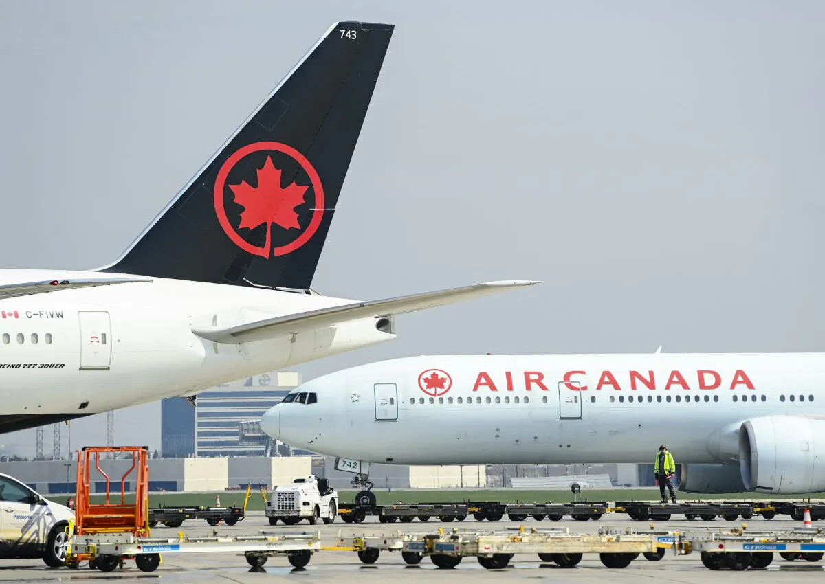 Air Canada planes sit on the tarmac at the Pearson International Airport in Toronto on April 28, 2021. (The Canadian Press/Nathan Denette)