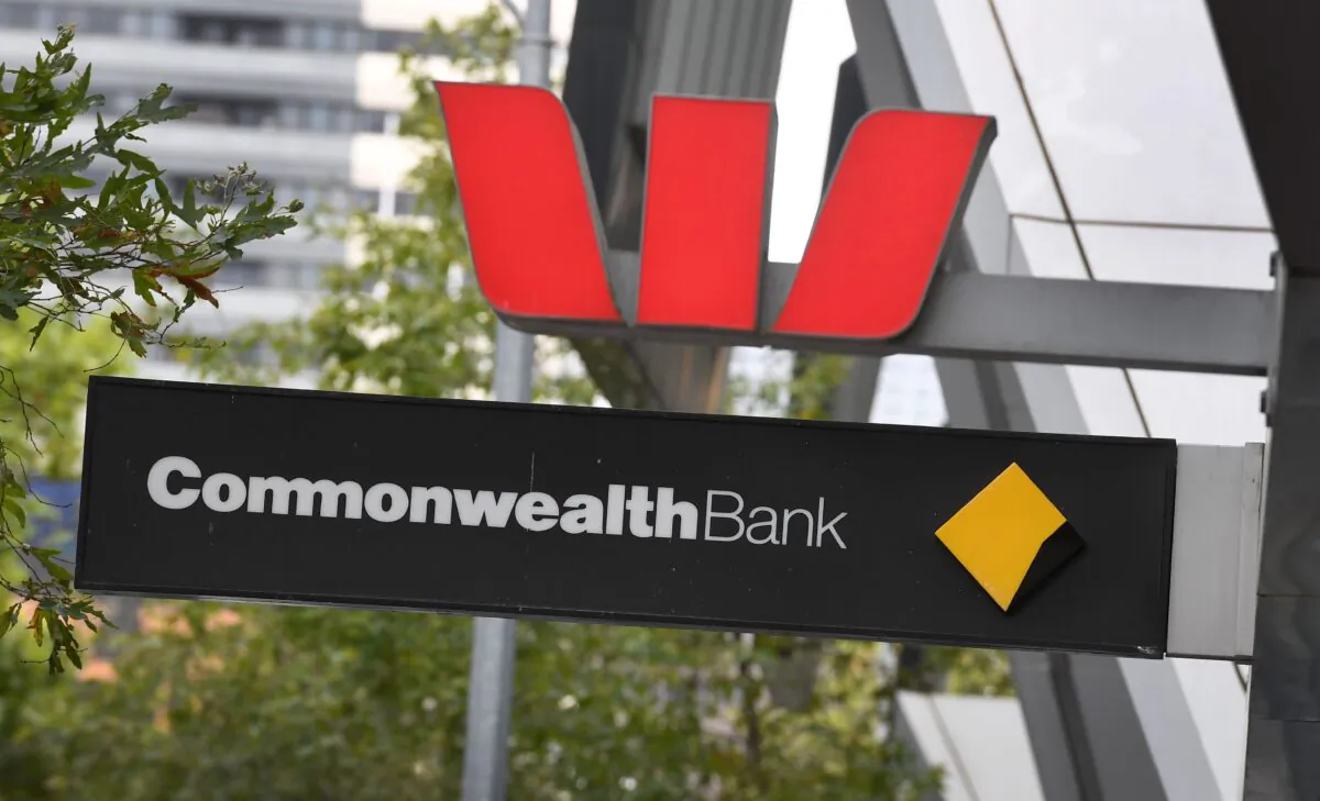 Signs adorn the branches of a Westpac and Commonwealth banks in Melbourne, Australia, on Feb. 4, 2019. (William West/AFP via Getty Images)
