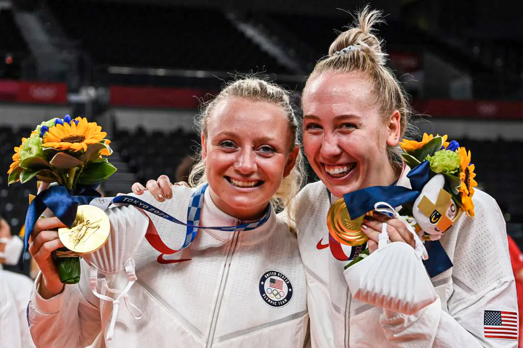 USA's Jordyn Poulter (L) and Michelle Bartsch-Hackley pose with their gold medals during the women's volleyball victory ceremony during the Tokyo 2020 Olympic Games at Ariake Arena in Tokyo on Aug. 8, 2021. (Yuri Cortez/AFP via Getty Images)