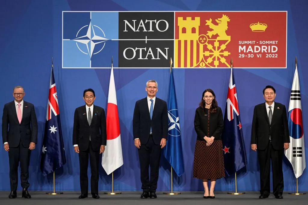 (L to R) Australia's Prime Minister Anthony Albanese, Japan's Prime Minister Fumio Kishida, NATO Secretary General Jens Stoltenberg, New Zealand Prime Minister Jacinda Ardern, and South Korea's President Yoon Suk-yeol pose for a group photograph ahead of a Indo-Pacific Partners meeting during the NATO summit at the Ifema congress centre in Madrid, on June 29, 2022. (Pierre-Philippe Marcou/AFP via Getty Images)