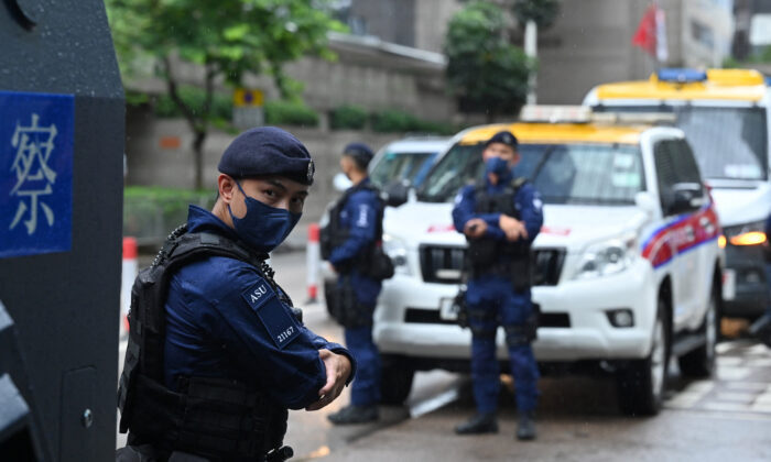 A special unit of the Hong Kong police provides security in the city's Wanchai district, as Chinese leader Xi Jinping arrives in Hong Kong to attend celebrations marking the 25th anniversary of the city's handover from Britain to China, on June 30, 2022. (Peter Parks/AFP via Getty Images)