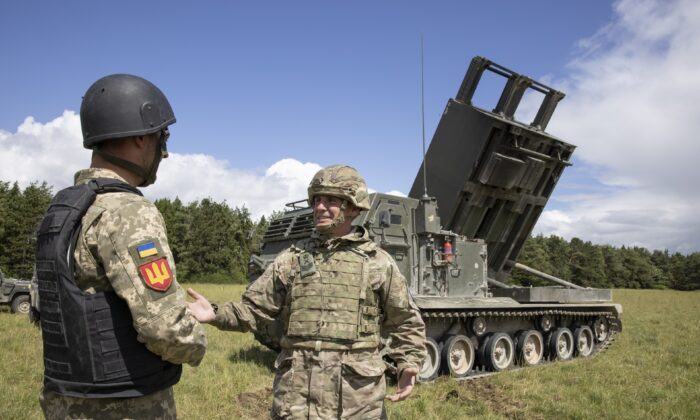 British army personnel teach members of the Ukrainian armed forces how to operate a multiple-launch rocket systems, on Salisbury Plain, Wiltshire, England, on June 25, 2022. (PA Media)