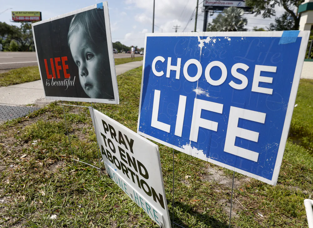 Pro-life signs are seen outside the All Women’s Health Center of Clearwater on May 3. The Supreme Court has struck down the landmark 1973 Roe v. Wade case that recognized a Constitutional right to an abortion. States can now ban the procedure. (TNS)